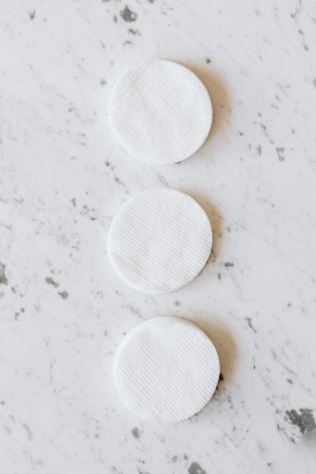 reusable cotton rounds on marble countertop