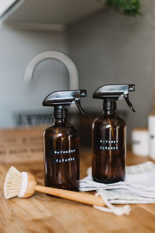 two glass cleaning spray bottles with labels